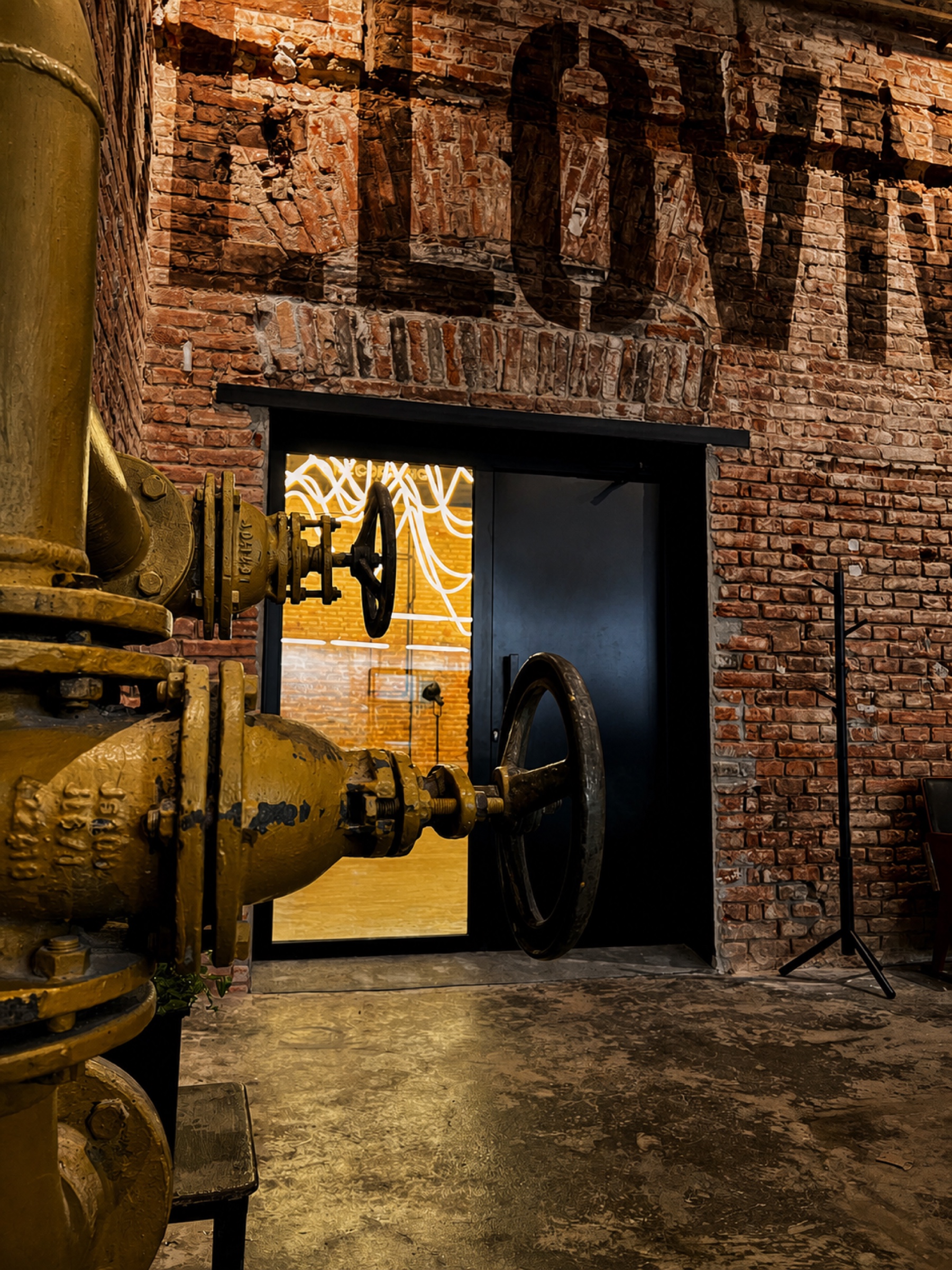 Original industrial valves and brickwork at Kabelovna Studios